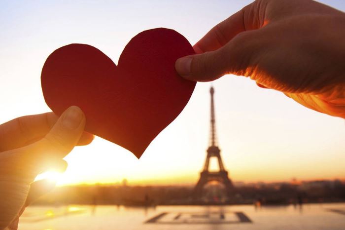 heart in hands, loving couple in Paris, France